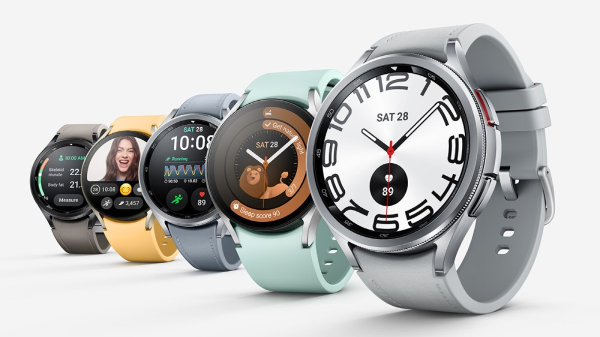 A lineup of five smartwatches in various colors, each displaying different apps and watch faces, arranged in a row against a clean, white background.